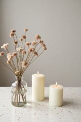 Cozy Minimalist Candle Arrangement with Dried Flowers and Warm Light