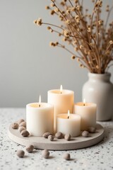 Cozy Minimalist Candle Arrangement with Dried Flowers and Warm Light