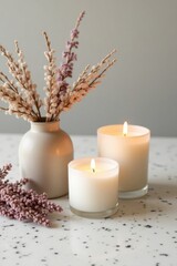 Cozy Minimalist Candle Arrangement with Dried Flowers and Warm Light