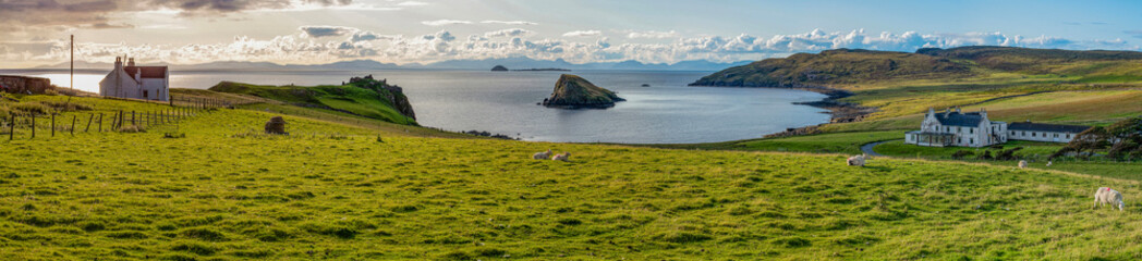 Isle of Skye, Scotland, Uk: view of the hamlet of Duntulm on the north coast of Trotternish, with Duntulm Castle ruins, seat in the 17th century of the chiefs of Clan MacDonald of Sleat
