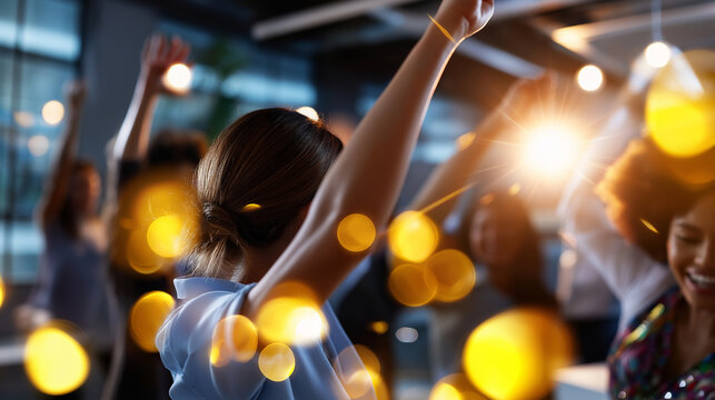 Soft-focus composition of faceless dancers moving joyfully in an office party environment, warm light and sparkly decor, with copy space.
