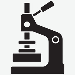 Black Silhouette Icon of a Button Making Machine
