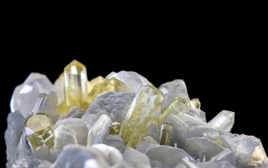 Yellow green brazilianite crystals emerge from pale matrix showing transparent brilliance and unique gemstone structure under perfect lighting conditions.