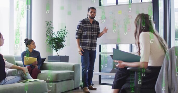 Pointing man wearing plaid shirt, jeans explaining on whiteboard in office lounge with binary code - Powered by Adobe