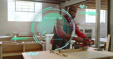 Carpenter wearing safety glasses sanding plank with red orbital sander in workshop, with AR overlay
