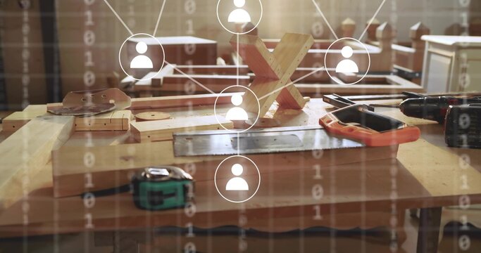 Showing bench featuring drill tape measure and X-puzzle at carpentry workshop, with network overlay