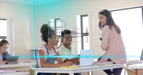 Leaning teacher wearing pink blazer guiding two students using laptop in classroom with tablet