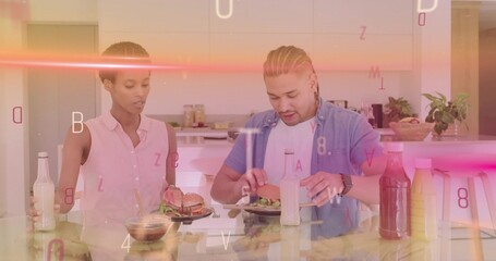 Couple cutting salads and burgers at white kitchen island, with water bottles and graphic overlays