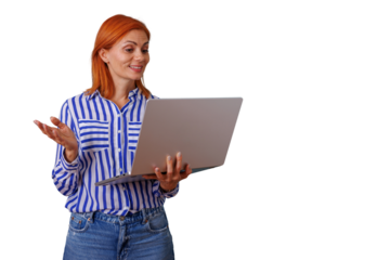 Woman with red hair presenting during a video call, communicating and networking online, looking at laptop