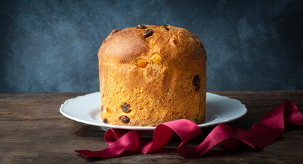 Panettone is a Christmas Italian sweet bread and dessert, a traditional Christmas and New Year's Eve sweet with dried fruit. Tastes of Italian Christmas, Northern Italy. Winter holiday 