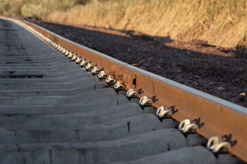 Railway tracks at sunset. New infrastructure for train traffic