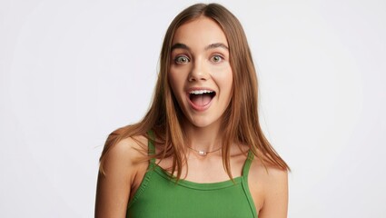 Excited woman expressing joy with a surprised look and bright smile