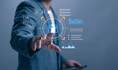 Businessman touching digital interface with customer analytics and data dashboard, representing CRM, AI targeting, data driven marketing, customer segmentation and intelligent business insights