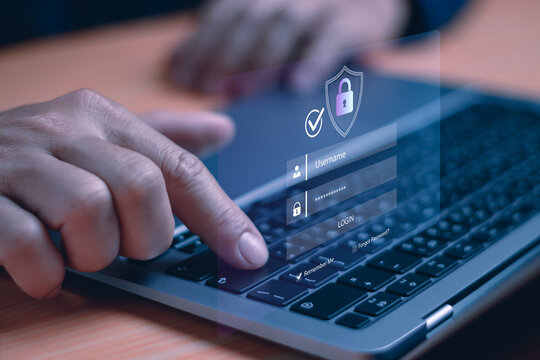 Close-up of hand typing on laptop with virtual login interface, representing cybersecurity, user authentication, secure access, password protection, online data privacy and digital identity safety - Powered by Adobe