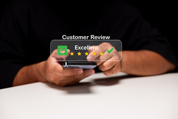 A person holds a smartphone displaying an excellent customer review with stars and a checkmark, suggesting positive feedback on a service or product.