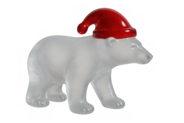 Polar bear figurine wearing a christmas hat preparing for winter holidays. Festive translucent animal decoration