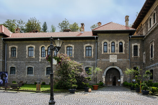 Busteni, Romania - June 24, 2024: Courtyard Entrance of Cantacuzino Castle in Busteni