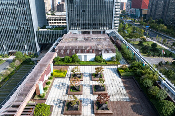 Overlooking the modern building's rooftop park