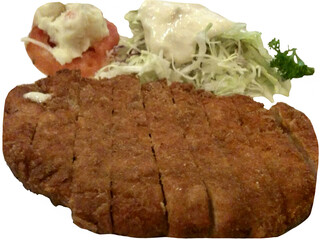 Isolated Japanese-style Tonkatsu served sliced over a plate with shredded cabbage, creamy dressing, tomato slice, and potato salad—crispy, balanced, and visually inviting