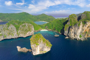 Magical paradise islands with rocks jungle forest on the coast of atoll coral reefs in Andaman Sea...