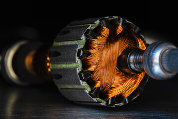 Close-up of electric motor rotor with metal structure and copper windings