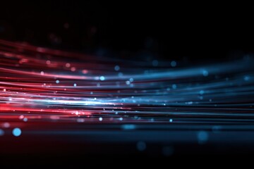 Abstract light trails in red and blue against a dark background.