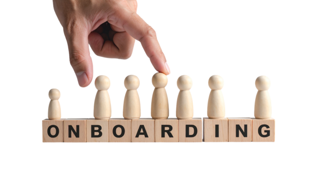 Hand selects wooden figure atop "ONBOARDING" blocks, symbolizing a new hire's integration
