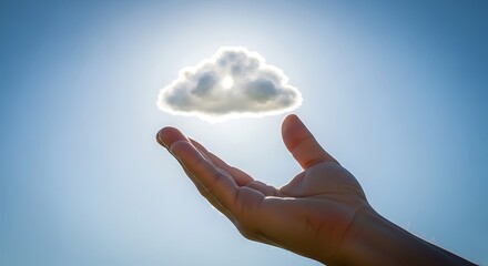 Hand holding a small cloud against a bright blue sky with sun rays