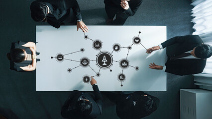 Collaborative Business Meeting with Innovative Mind Map Visualization on Table Representing Ideas...