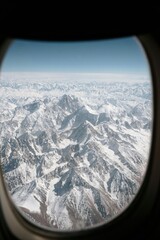 airplane window view above the clouds