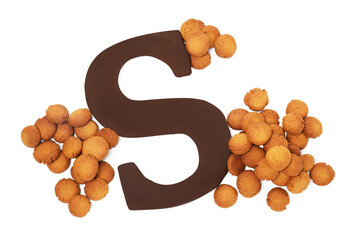 Saint Nicholas (Sinterklaas) day. Kruidnoten cookies and chocolate letter S isolated on white, top...