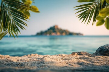 Sandy foreground with palm leaves framing a blurred sea and island under a bright sky