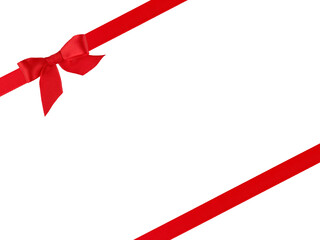 Red satin ribbon with red bow located diagonally isolated on white background with clipping path....