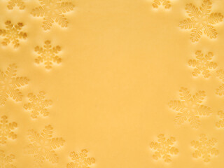 Rolled out dough with cut out Christmas snowflakes shapes texture isolated on white background with clipping path. Design element. Top view. Christmas baking.