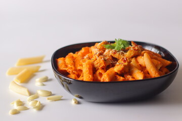 Red Sauce pasta. Creamy penne pasta in rich red sauce, topped with grilled chicken, chili flakes