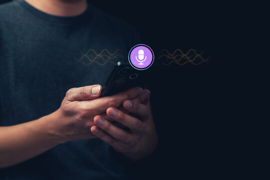 Person hold smartphone with glowing voice assistant and sound wave, representing AI-powered online customer support, telemarketing, virtual consulting, call center technology, smart communication.