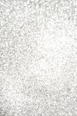 Obraz premium Silver Sparkling Lights Festive background with texture. Abstract Christmas twinkled bright bokeh defocused and Falling stars.