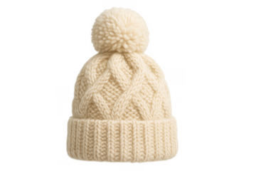 Cream cable knit beanie with fluffy pom-pom protecting head from winter cold, warmth, and cozy fashion