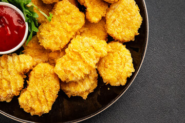 Chicken nuggets fast food natural tasty appetizer fresh delicious gourmet food background on the table rustic top view copy space