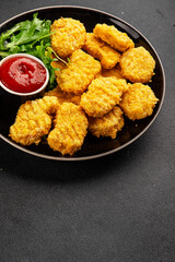 Chicken nuggets fast food natural tasty appetizer fresh delicious gourmet food background on the table rustic top view copy space