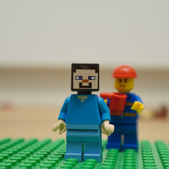 Naklejka premium Minecraft Steve Lego figure with a construction worker minifigure