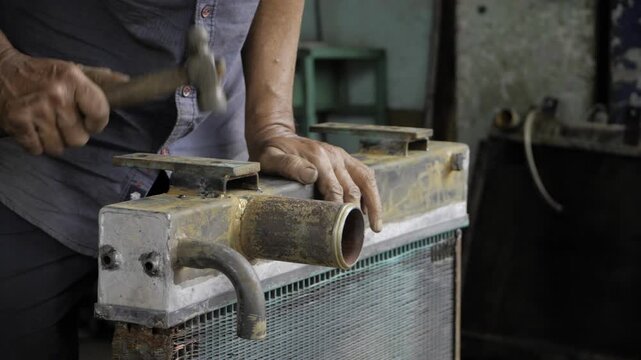 Mastery in Action - Expert Hands at Work on a Radiator