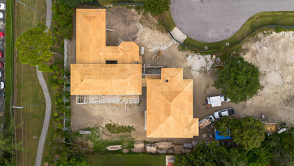 Aerial view of new house roof under construction 