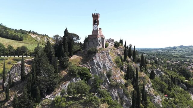 Aerial approach and top-down view of medieval clock tower, Brisighella, Emilia-Romagna, Italy