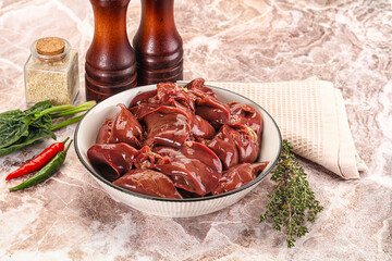 Raw uncokked chicken liver in the bowl
