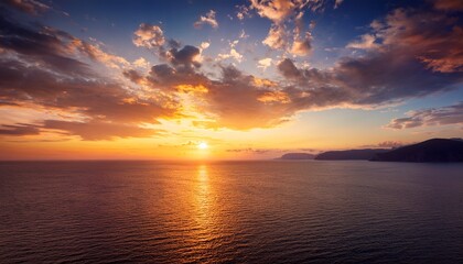 Obraz premium Sunset Sky Clouds Over Sea In The Evening With Orange Yellow Sunlight On Golden Hour Horizon Sea Sky Landscape Mountain Nature Background Autumn Sea Sky