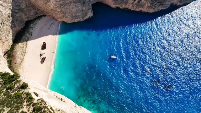Aerial drone cinematic video of one of the most photographed beaches in the world called navagio or shipwreck a ship rest to rust ashore vanishing through the years, Zakinthos island, Ionian, Greece