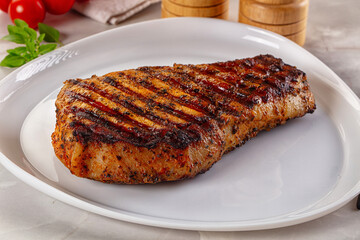 Grilled pork steak with bone
