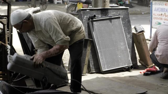 Elderly Man Inspects Bag - A Moment of Curiosity