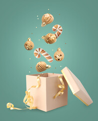 Christmas celebration. Chocolate candies and cookies falling into gift box on pastel turquoise background